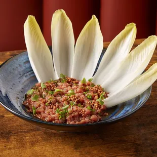 Thai Style Tuna Tartare

-Bluefin Tuna
-Belgian Endives
-Citrus
-Toasted Rice