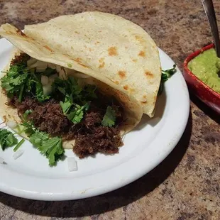 a taco and guacamole