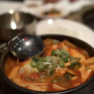 a bowl of soup with a spoon in it