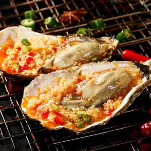 two oysters on a grill