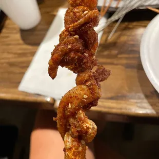 Finally received chicken skin skewers 1hour and 20 minutes later . Full of hair