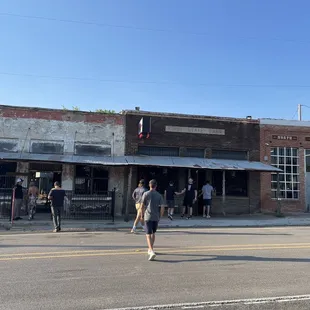 a group of people walking down the street