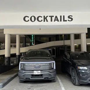 two cars parked in a parking garage