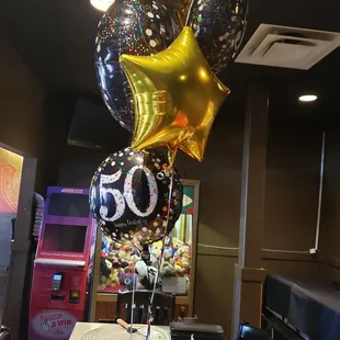 a bunch of 50th balloons