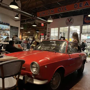 Centerpiece vintage Fiat where two diners sit and enjoy their meal