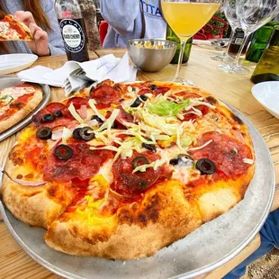 Pizza and wine on the patio at Garage-East