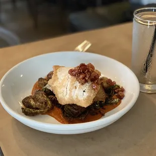 a plate of food and a glass of water