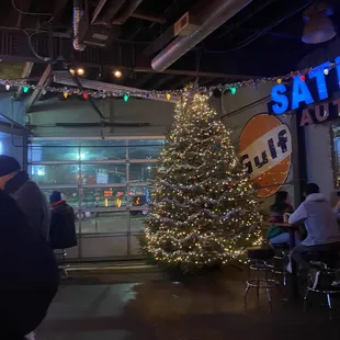 a christmas tree in a garage