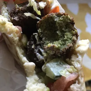 A few bites into the falafel sandwich.