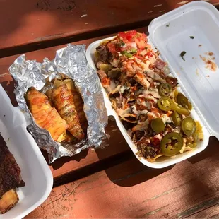 a variety of food items on a picnic table