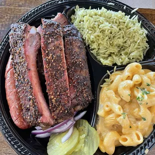 3 Meat Plate with brisket,ribs and sausage. The sides were jalapeño rice and mac n cheese.