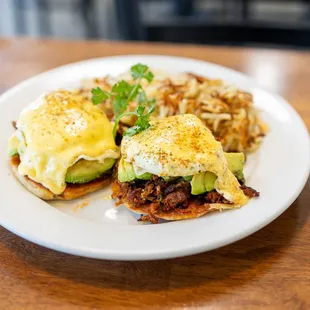 Chorizo Benedict. With avocado and homemade hollandaise sauce.