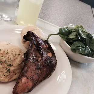 Baked chicken, mashed potatoes, baby spinach and that roll