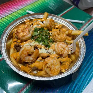 a plate of shrimp and pasta