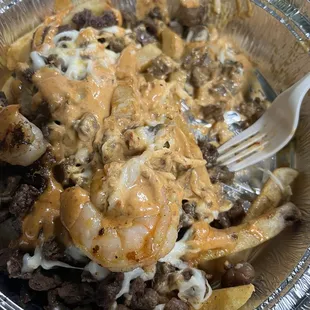Shrimp and steak Earthquake Fries Plate