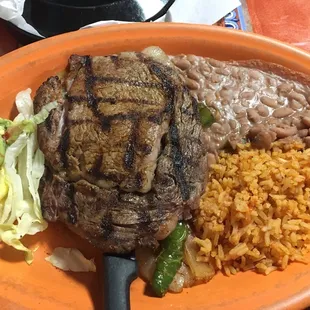 La Plancha ( Fajita veggies underneath) served w/ flour tortillas!