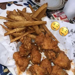 a plate of fried chicken and fries