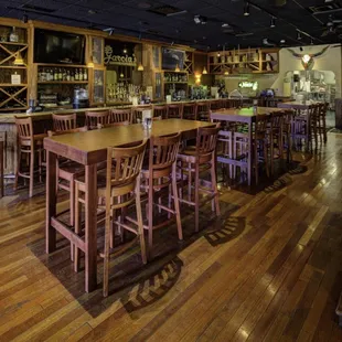 Fantastic and inviting bar great for after hours from work or watching your favorite sport on 3 flat screen 60 inch TVs