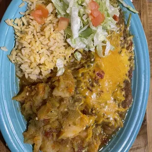 Chile relleno plate with rice and papas covered with green chile