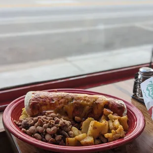 Brisket breakfast burrito, red chile plate with papas and whole beans