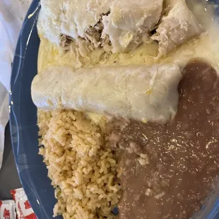 Sour cream enchiladas with rice and beans.  I started cutting into it before taking the picture. Oops