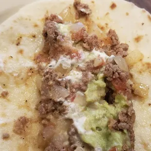 Inside a picca dillo taco and I added sour cream and avocado