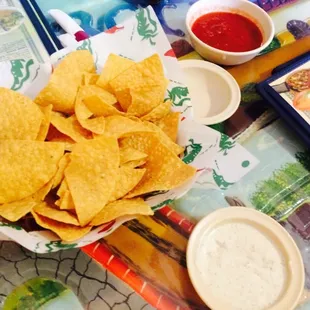 Always Fresh, Hot, and Crunchy Chips with Salsa and their Special White Sauce. Yummy!