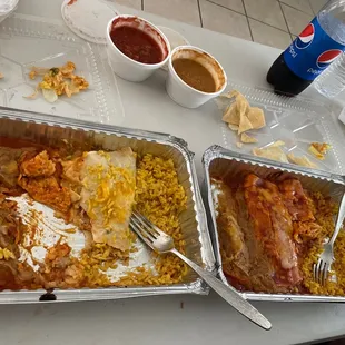 Cheese enchilada &amp; sour cream chicken enchilada. Two chicken enchiladas with beans and rice.