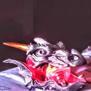 a dragon head on a plate