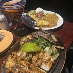 Combination steak chicken and shrimp fajitas