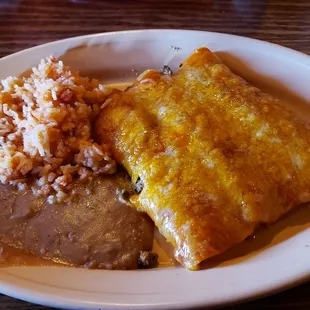 a plate of enchiladas and rice