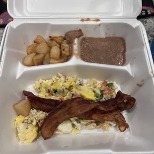 a breakfast in a styrofoam container