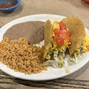 Two crunchy beef taco dinner with refried beans and rice
