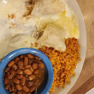 a plate of food with beans, rice, and ham