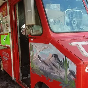 a taco truck parked in a parking lot