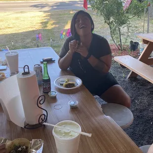 The toughest taco critic enjoying her tacos