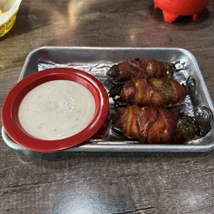 Cream cheese cheese stuffed bacon wrapped deep fried jalapeños