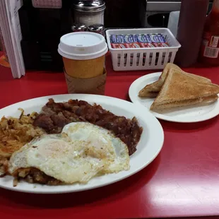 Corn Beef Hash w/ home fries, eggs, and toast.