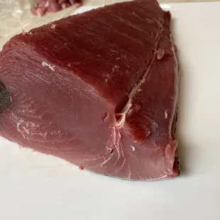 a piece of meat on a cutting board