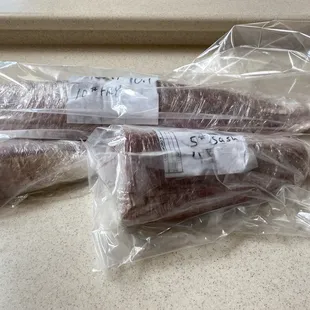 two sausages wrapped in plastic