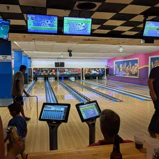 people playing a bowling game