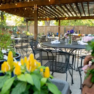 outdoor dining area with tables and chairs