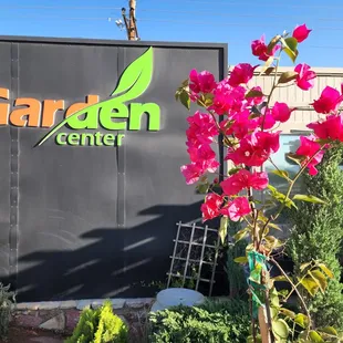 a large sign with pink flowers
