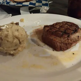 Mashed potatoes and filet mignon steak. Was very good but undercooked so ordering medium is best here, once cooked again was delicious.