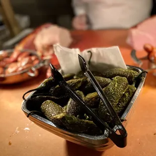  bowl of pickled cucumbers on a table