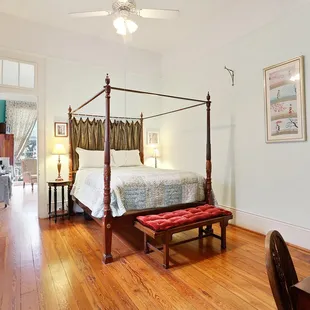 One of the Balcony Suites with queen bed, sitting room with 2 twin beds (trundle) and private bathroom with claw foot tub/shower