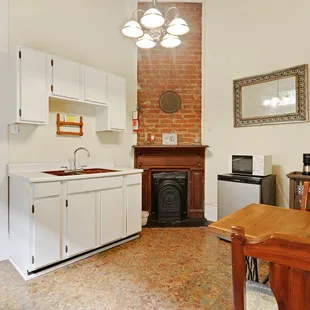 Rose Room with queen bed, ensuite bathroom with shower only and kitchenette (no stove) on 2nd floor.