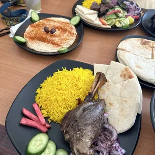 Hummus and Pita / Salad / Lamb Shank / Rice / Beef Kabob Plate.