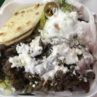 a meal in a styrofoam container