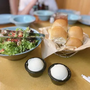 a bowl of salad and a sandwich